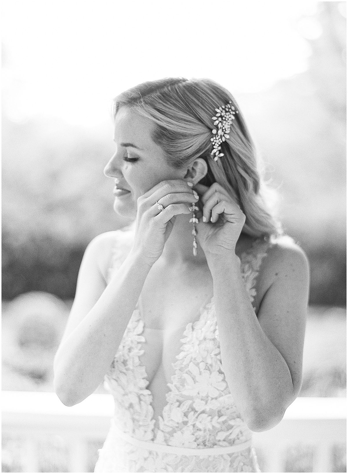 Black and White of Bride Putting in Earrings Photo