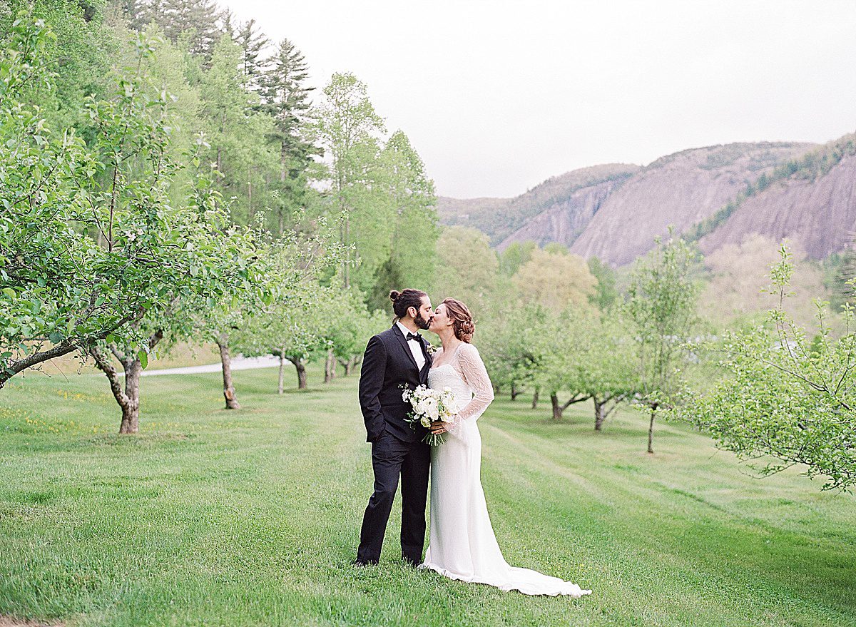 Bride and Groom Kissing at Lonesome Valley Wedding in Cashiers Photo