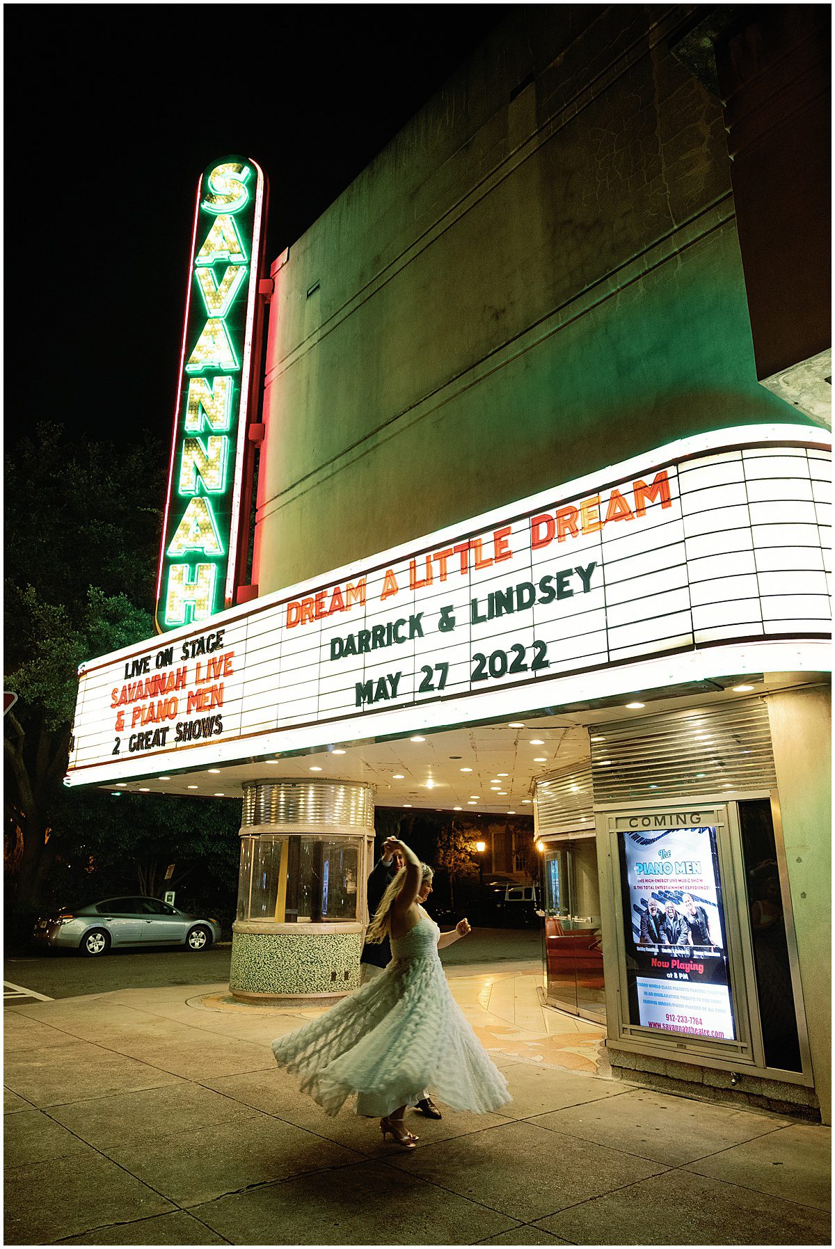 Bride and Groom Twirling in Front of Savannah Theatre Photo