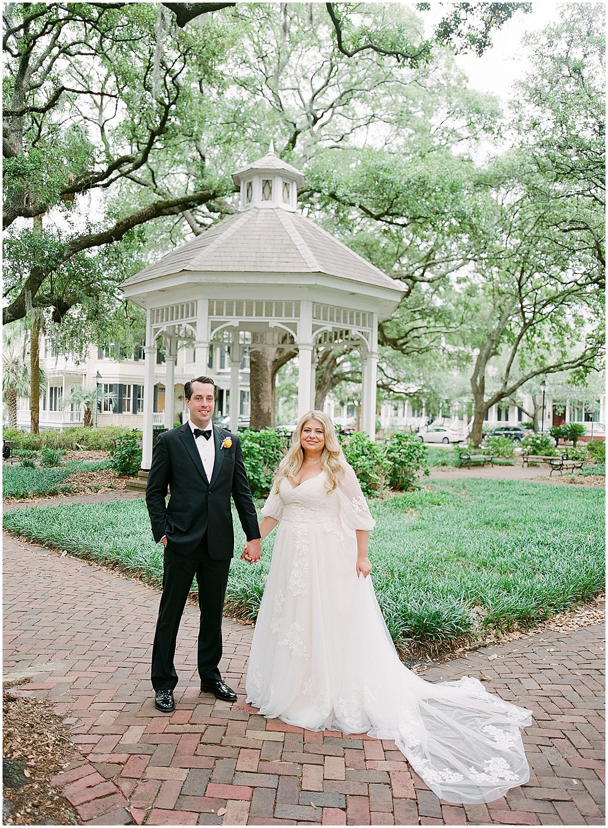 Bride and Groom Holding Hands in Whitefield Square Savannah Georgia Photo