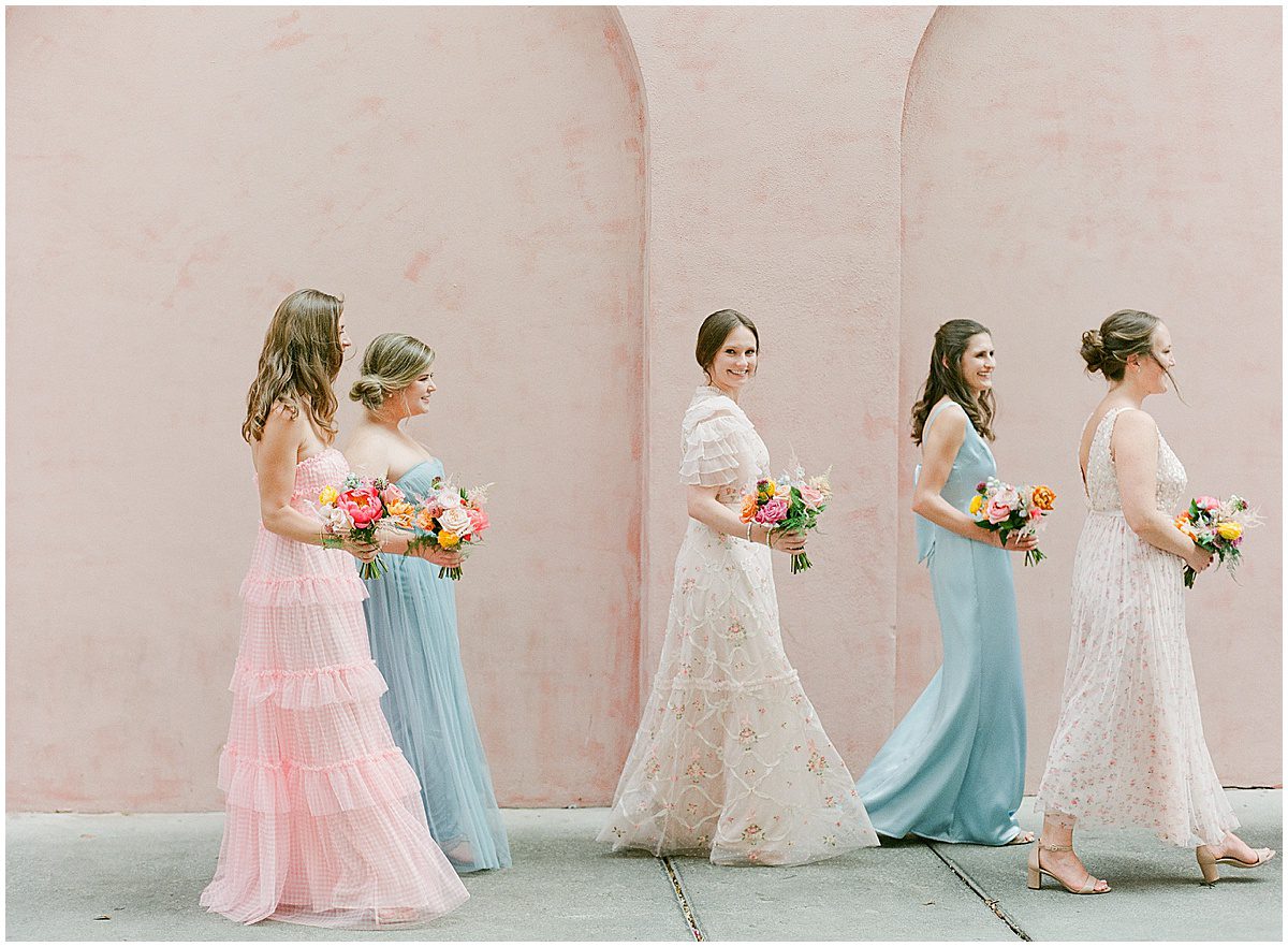 Bridesmaids Walking in Front of Old Pink House at Savannah Wedding Photo
