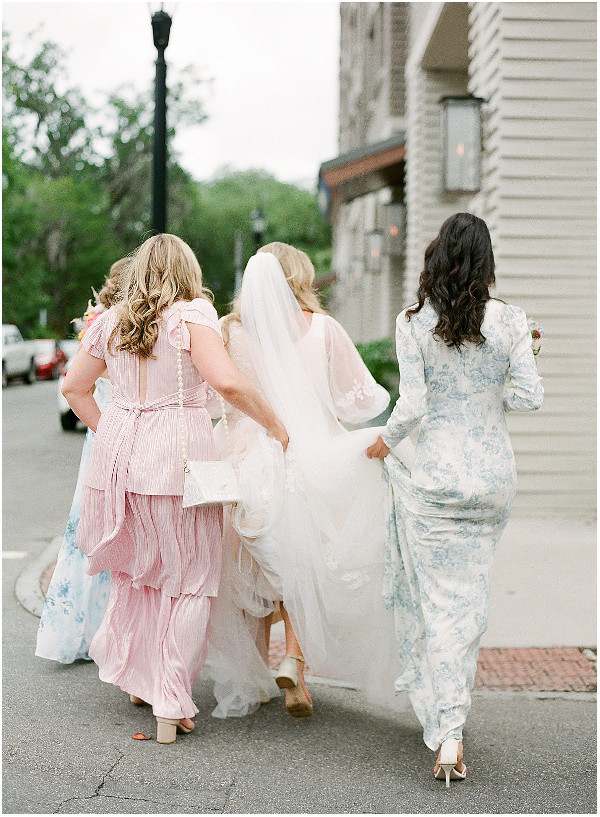 Bridesmaids Holding Brides Dress in Savannah Georgia Photo