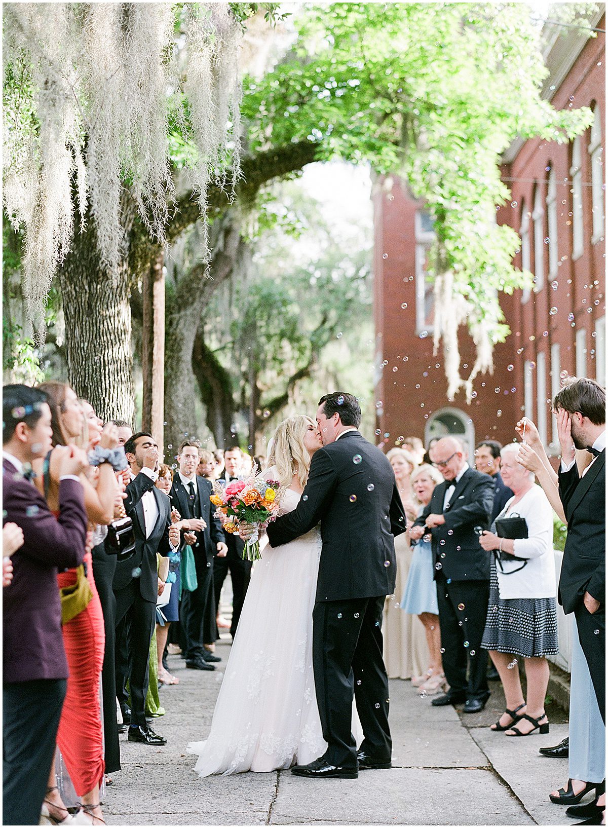Bride and Groom Kissing During Bubble Exit After Wedding Ceremony Savannah Wedding Photo