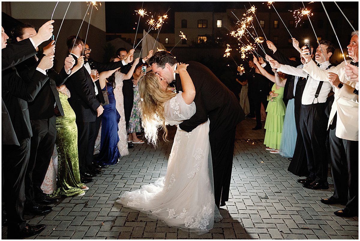 Bride and Groom Kissing at Sparkler Exit at Victory North Savannah Wedding Photo