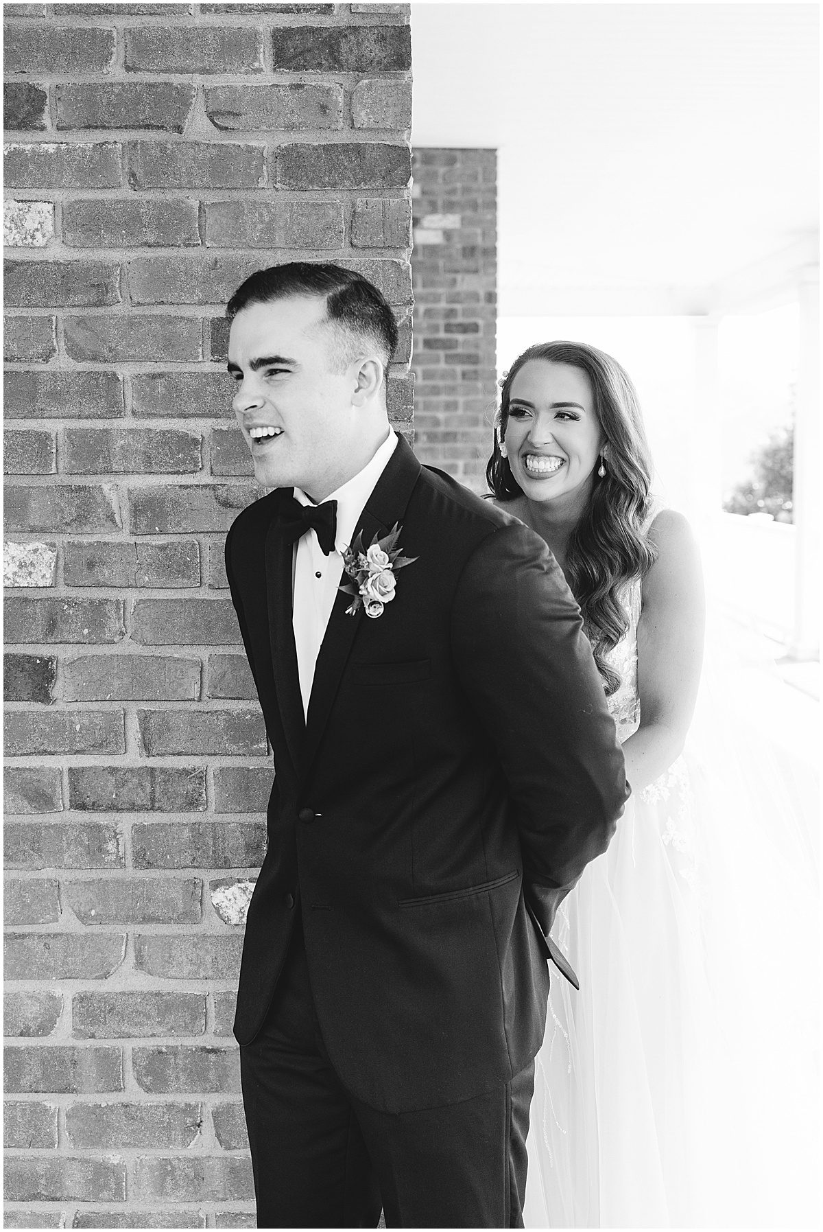 Black and White of Bride and Grooms First Touch Photo