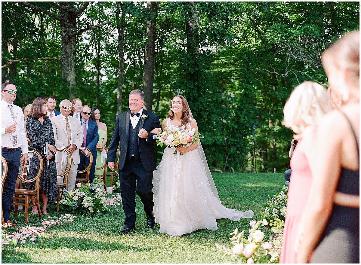 Bride Walking Down Ceremony Aisle with Dad Photo
