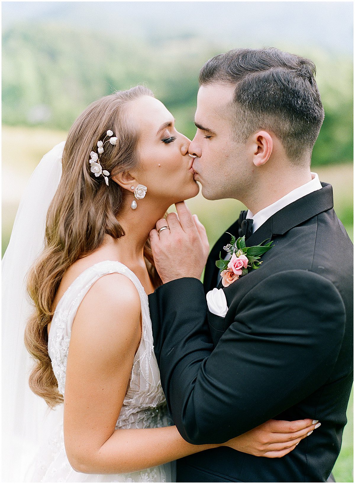 Bride and Groom Hugging and Kissing at The Ridge Asheville Photo