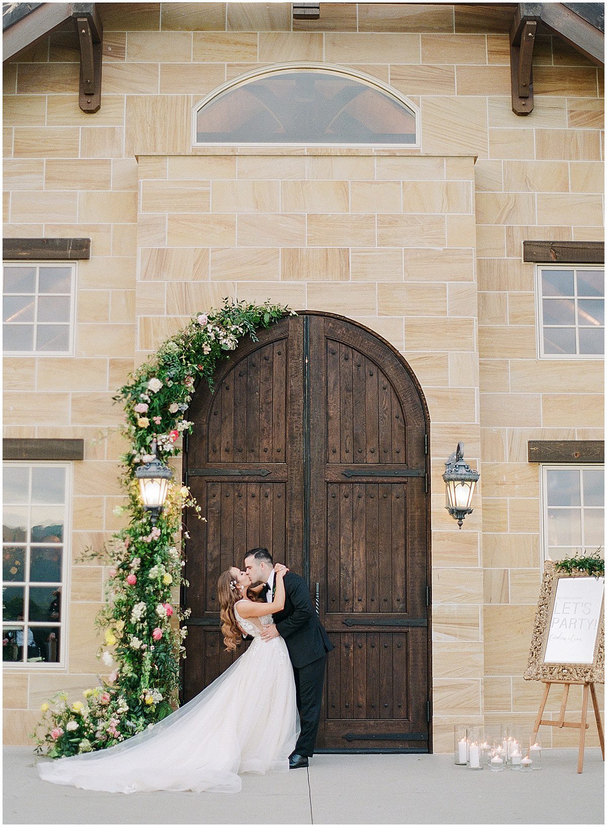 Bride and Groom Kissing In Front of The Doors of the Chateau at The Ridge Asheville Photo