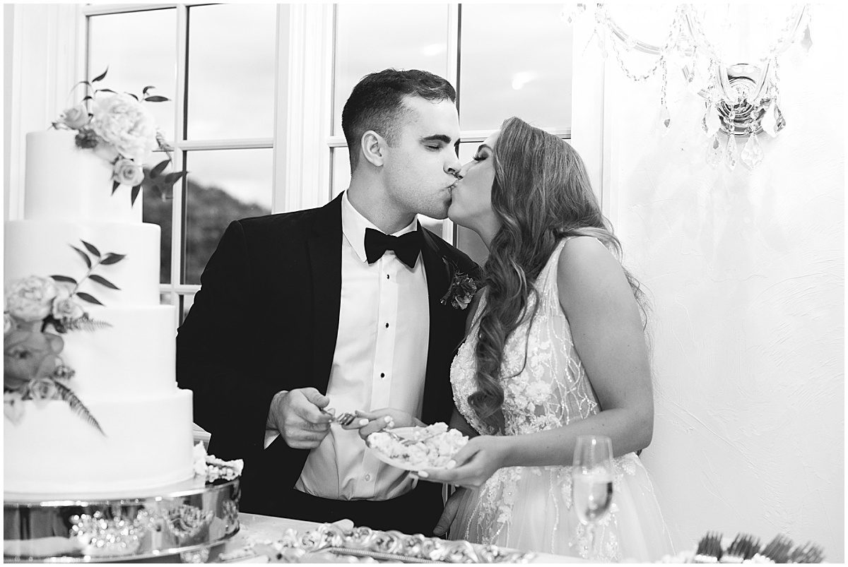 Black and White of Bride and Groom Kissing Photo