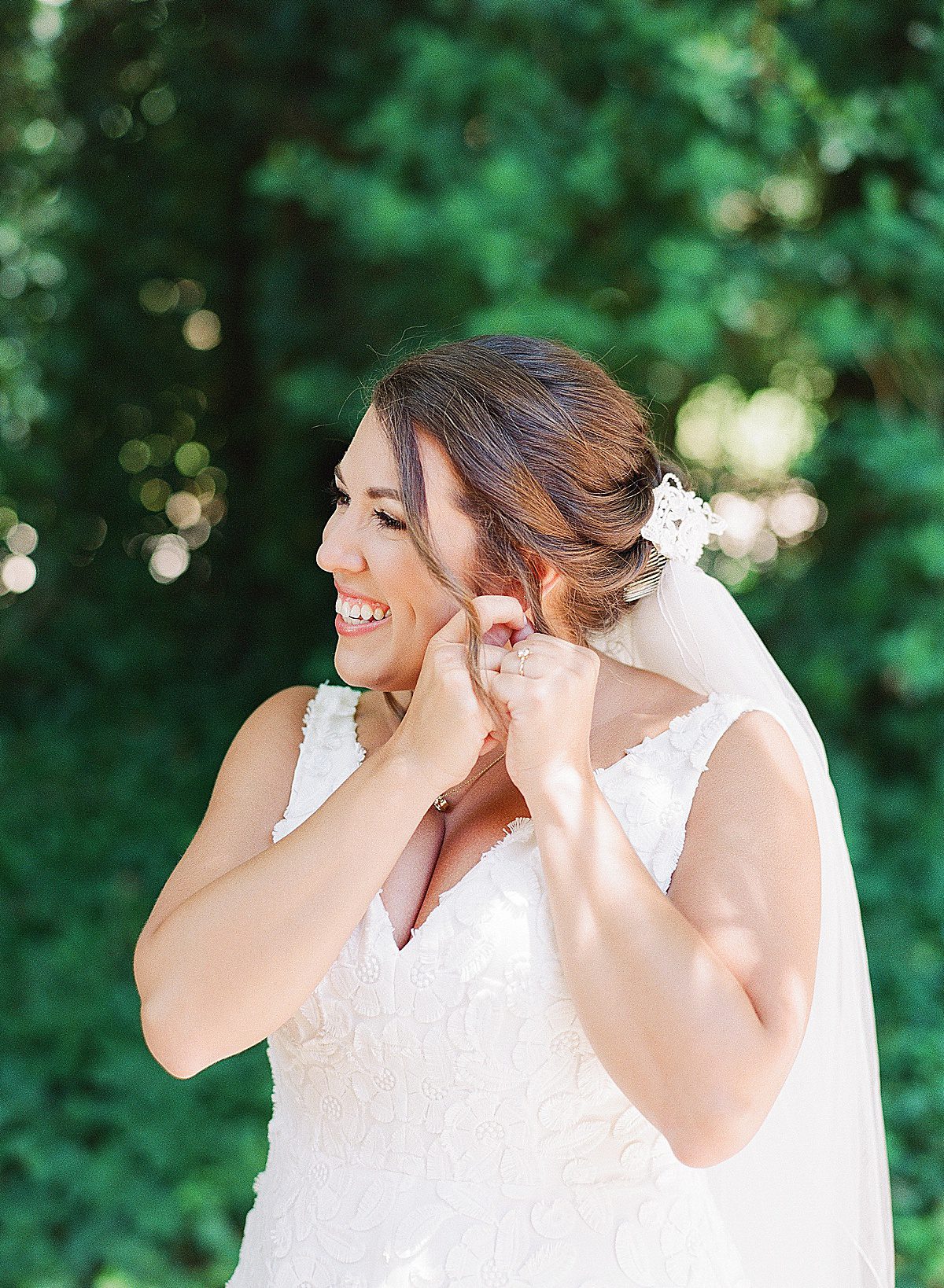 Bride Putting In Earrings Photo