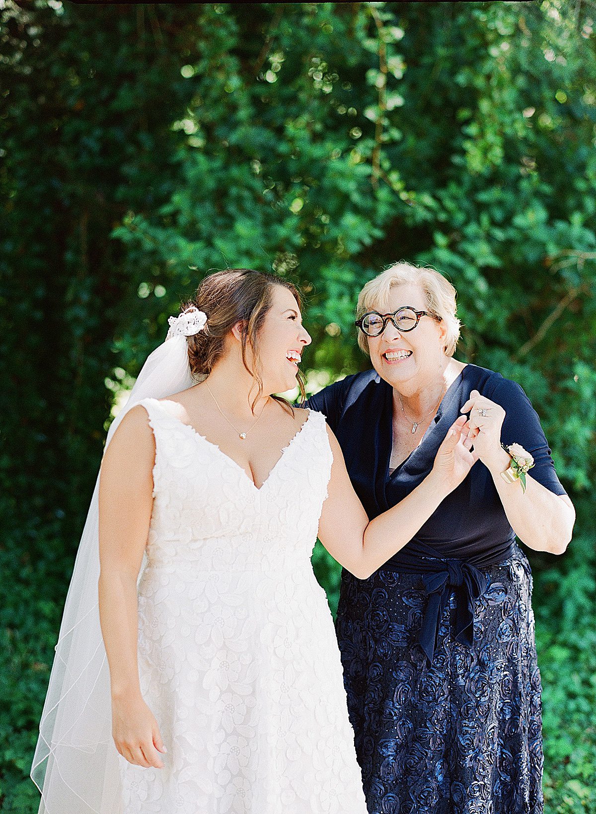 Bride Laughing with Mom Photo