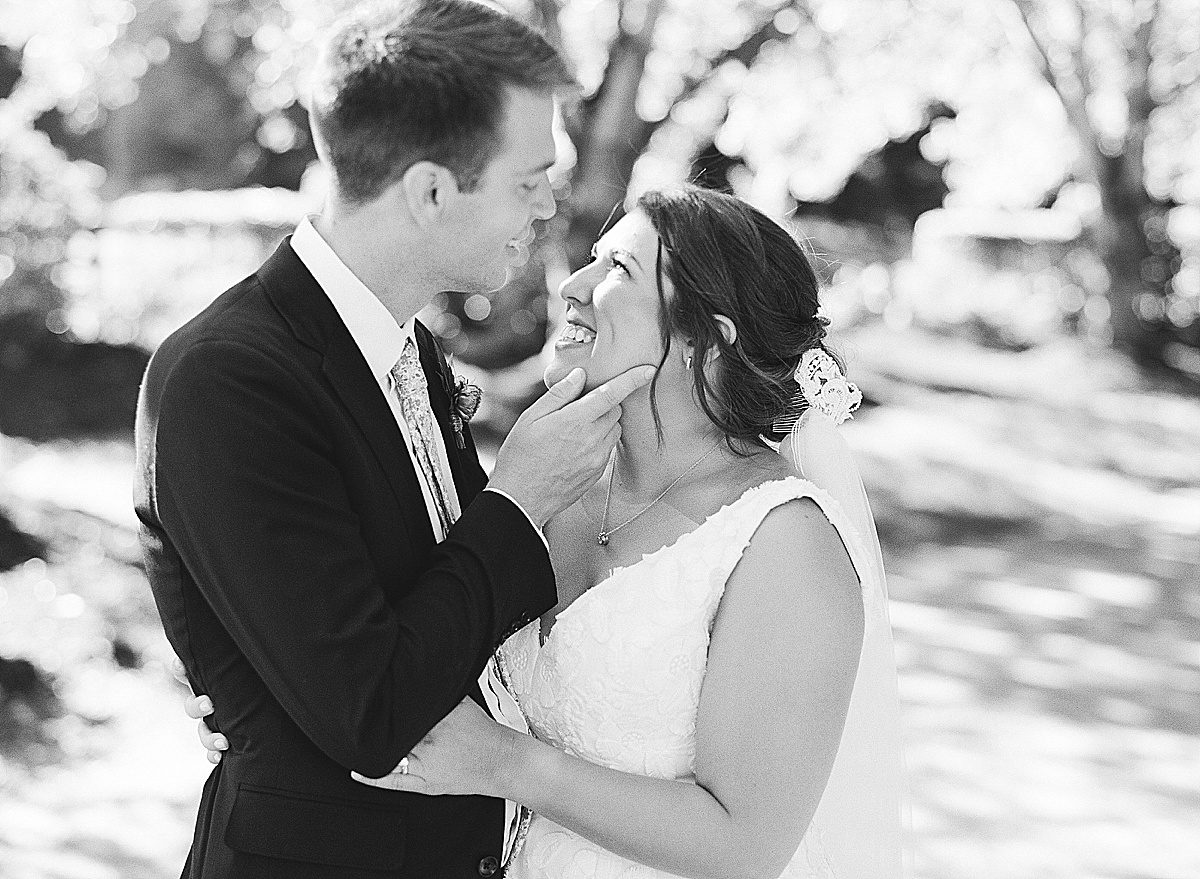 Black and White of Bride and Groom Smiling at Each Other Photo