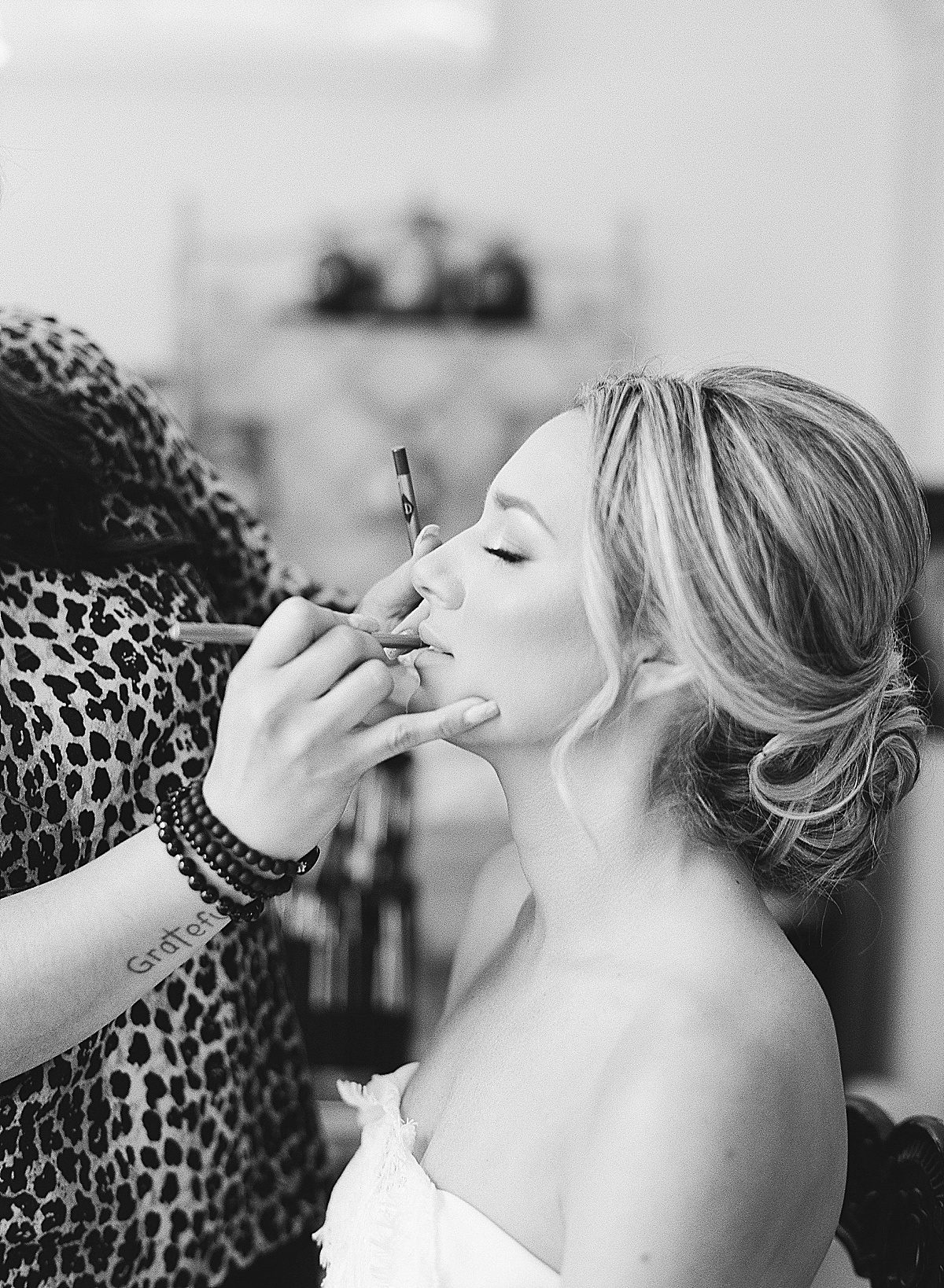 Black and White of Bride Getting Makeup Done Photo