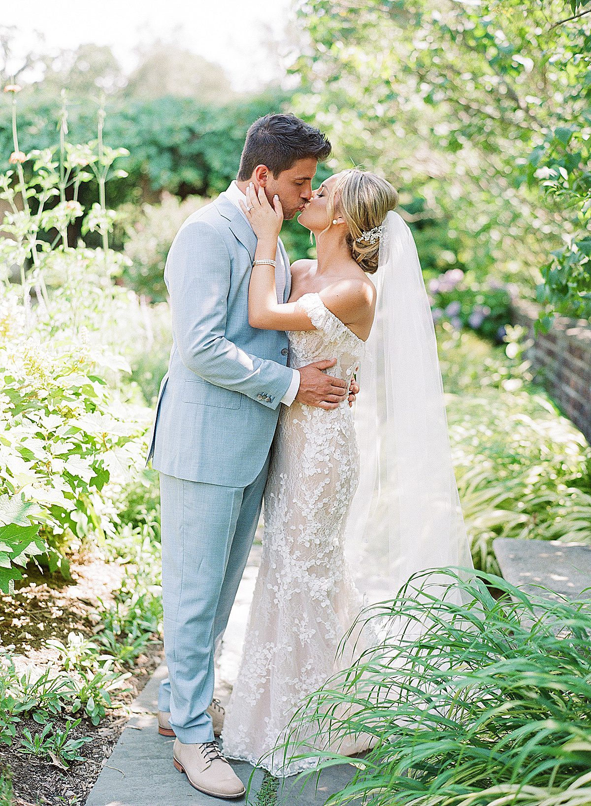 Bride and Groom Kissing at Planting Fields Arboretum Photo