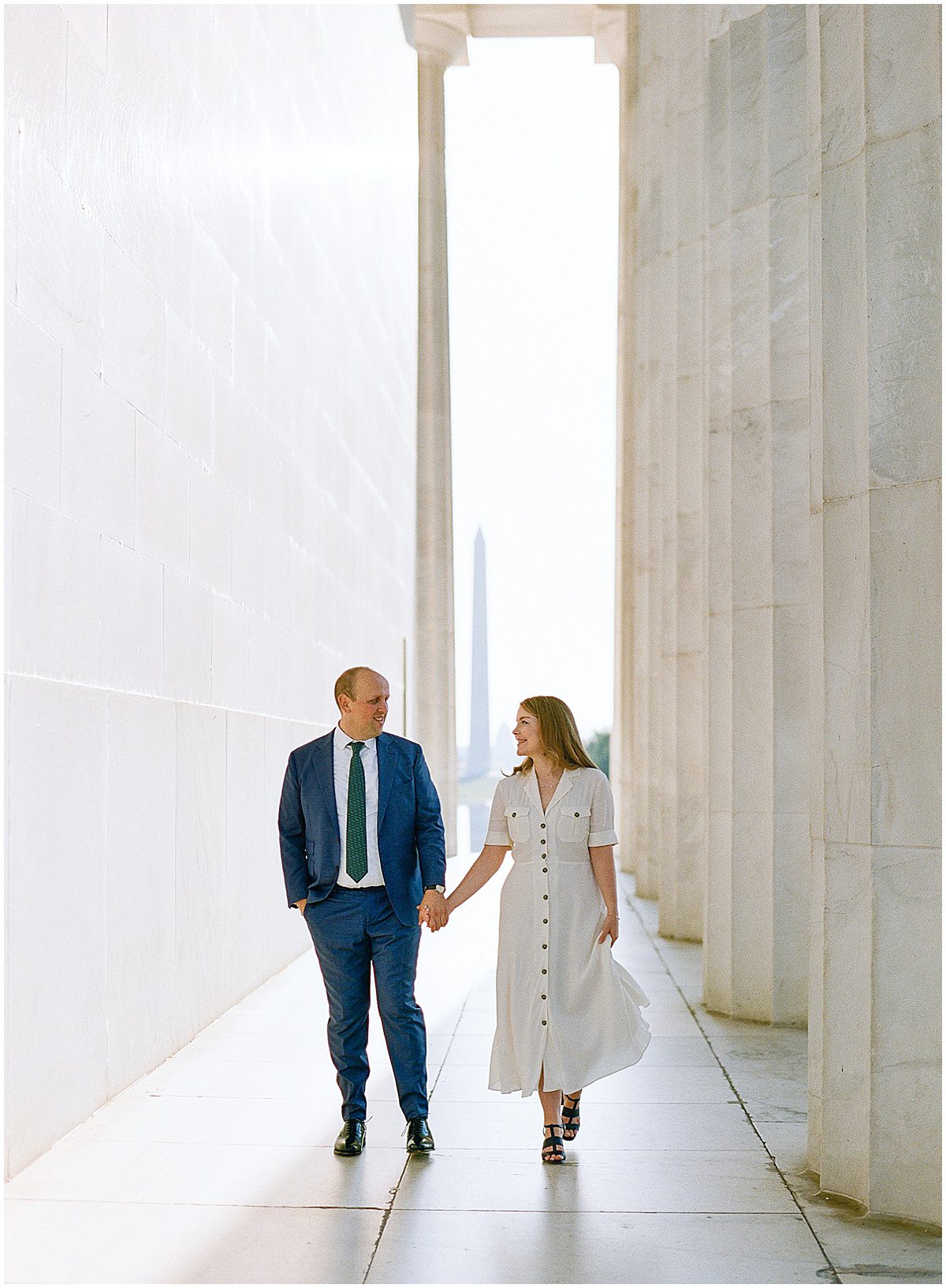 Luxury Washington DC Photographer Couple Walking in Pillars at Lincoln Memorial Photo