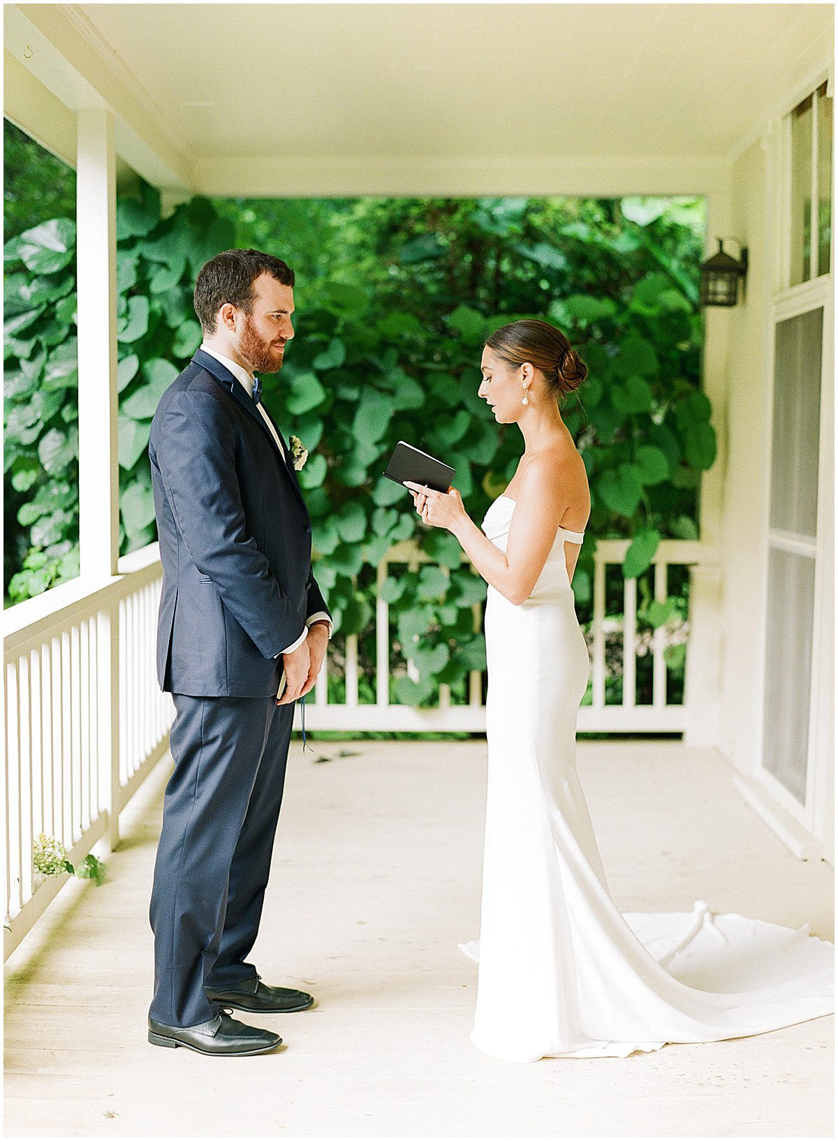Bride and Groom Sharing Vows on Porch Photo