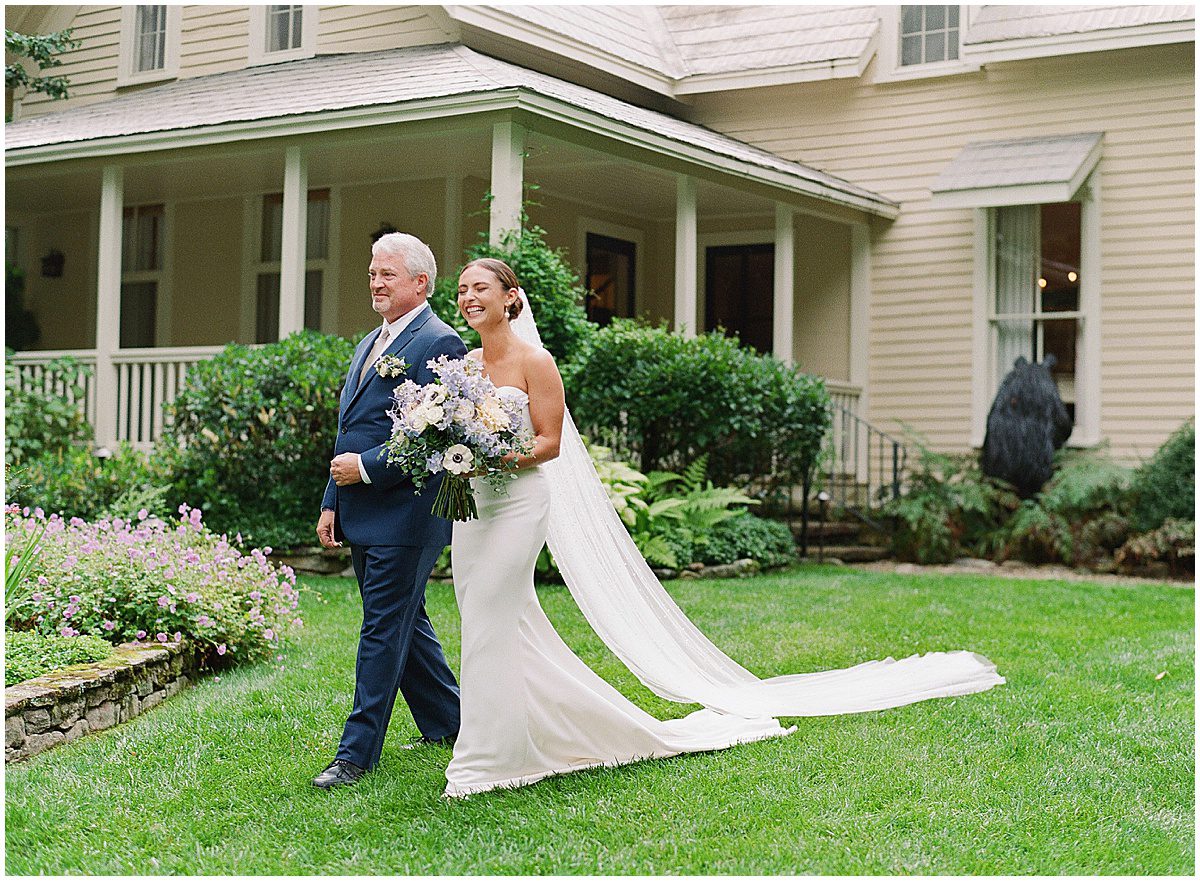 Bride with Father Walking Down Aisle Photo