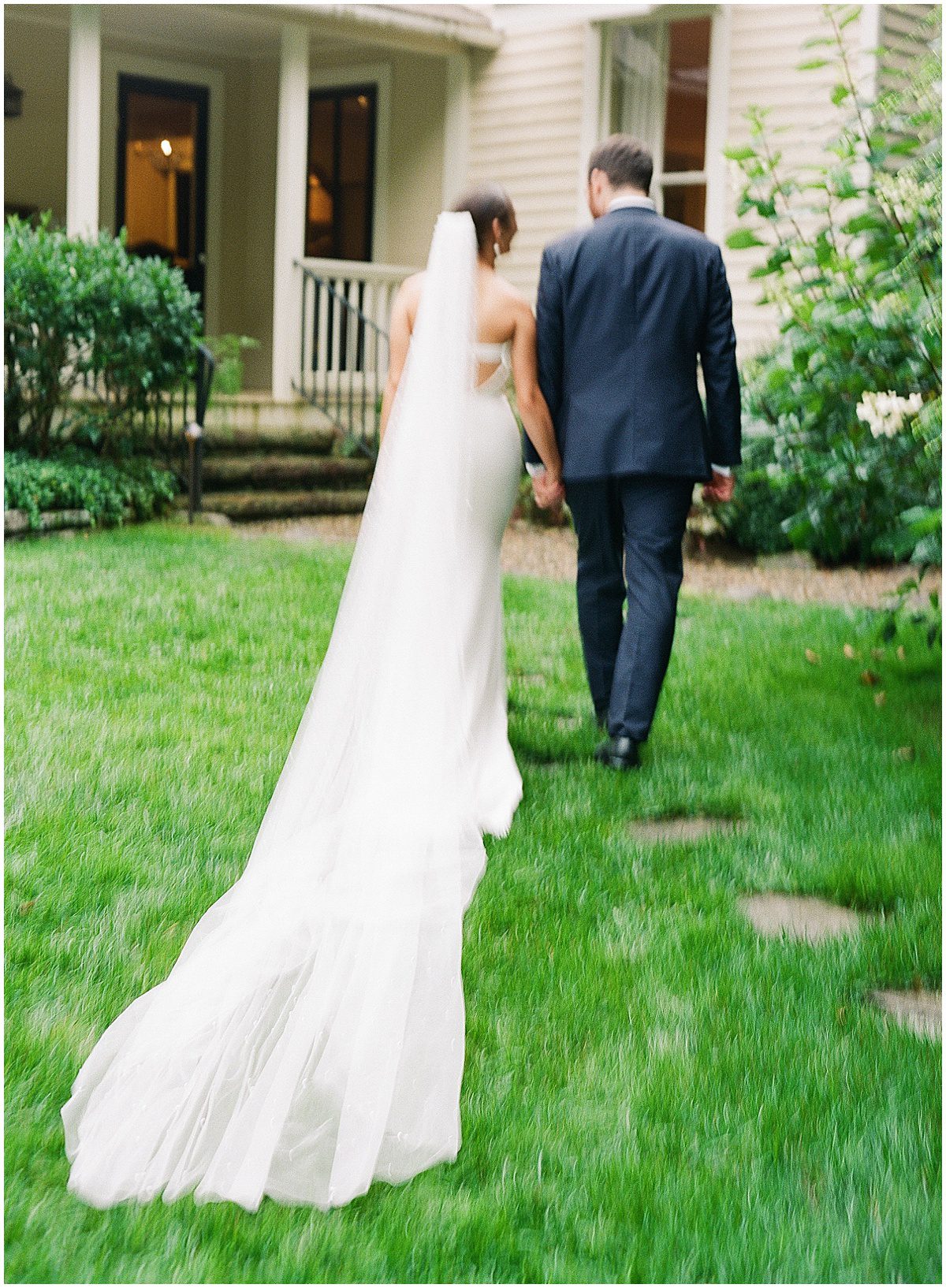 Luxury Wedding Photographer in Highlands NC Bride and Groom Walking Away from Camera Photo