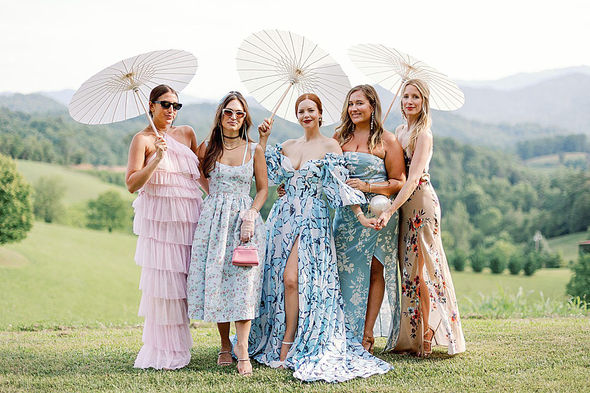 Bride with Friends Holding Parasols at The Ridge Asheville Wedding Venue Photo