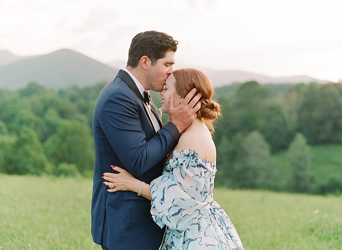 Groom Kissing Bride on Head at The Ridge Asheville Wedding Venue Photo