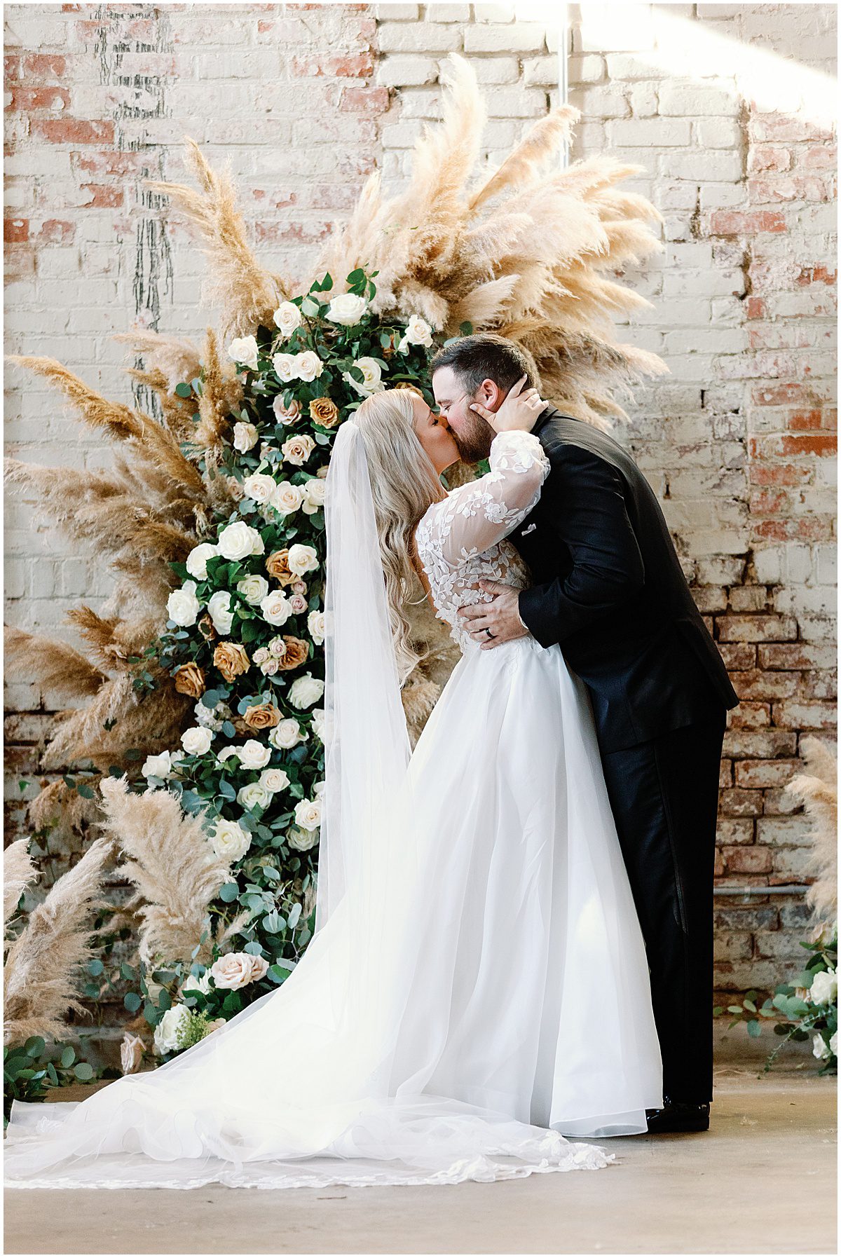 Bride and Groom First Kiss at Ceremony Atlanta Georgia Wedding at Guardian Works Photo