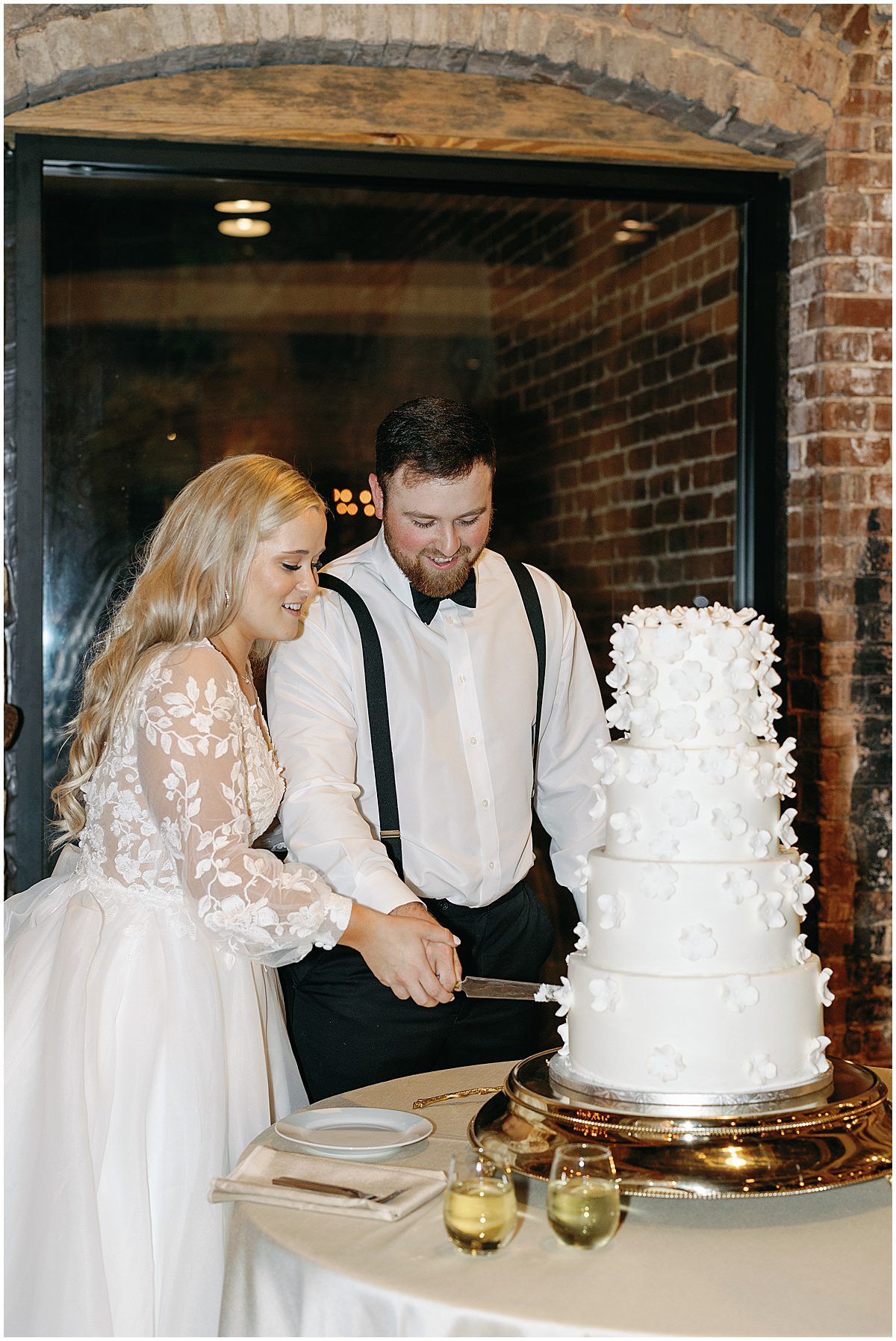 Bride and Groom Cutting cake at Guardian Works Wedding Photo