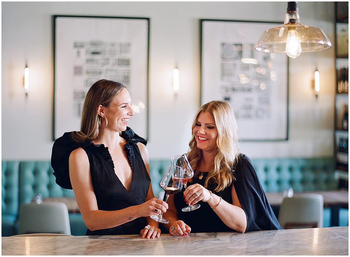 Ladies Clinking Wine Glasses Smiling Photo