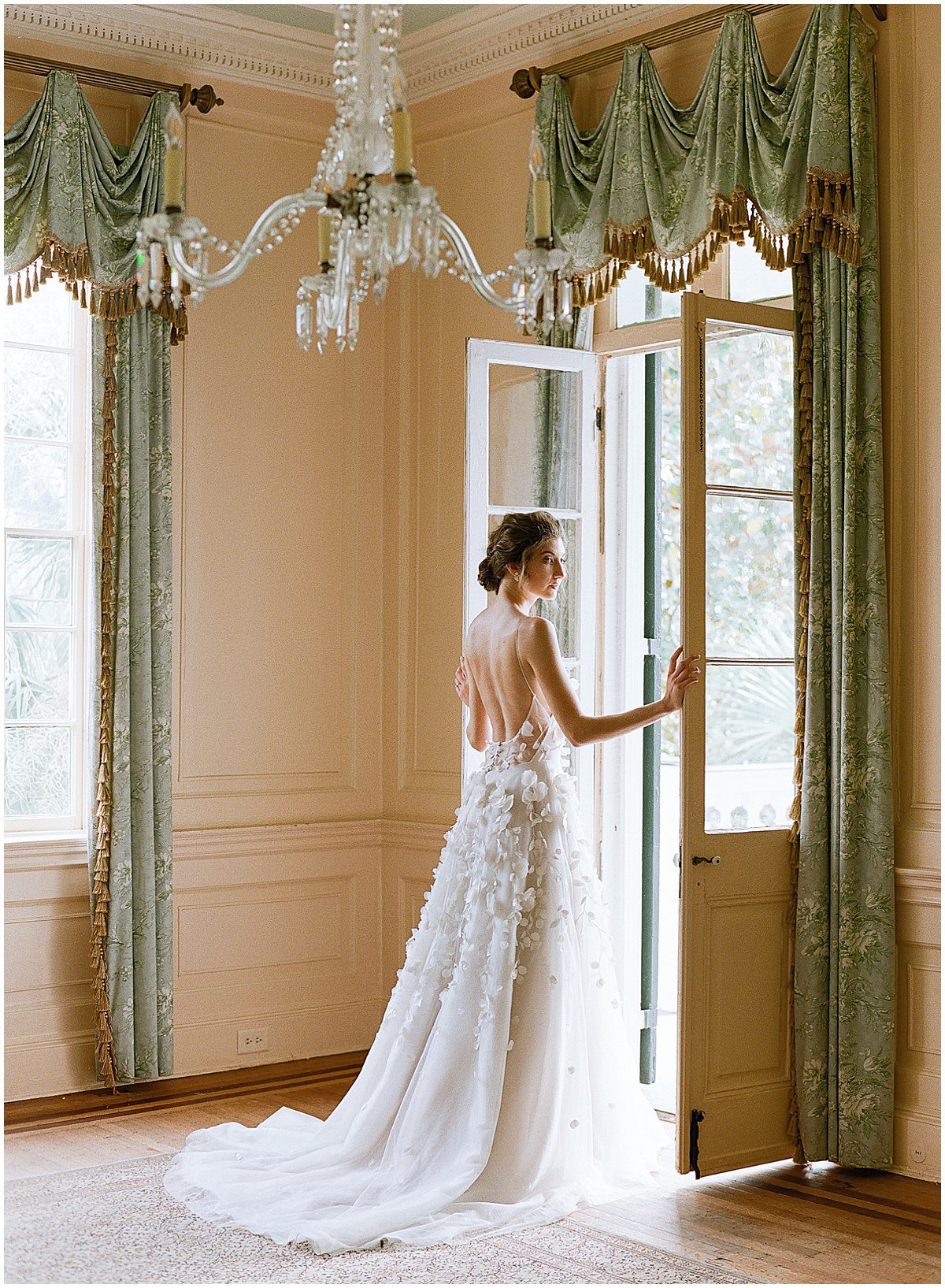 Bride Holding Doors Open Looking Over Shoulder Photo