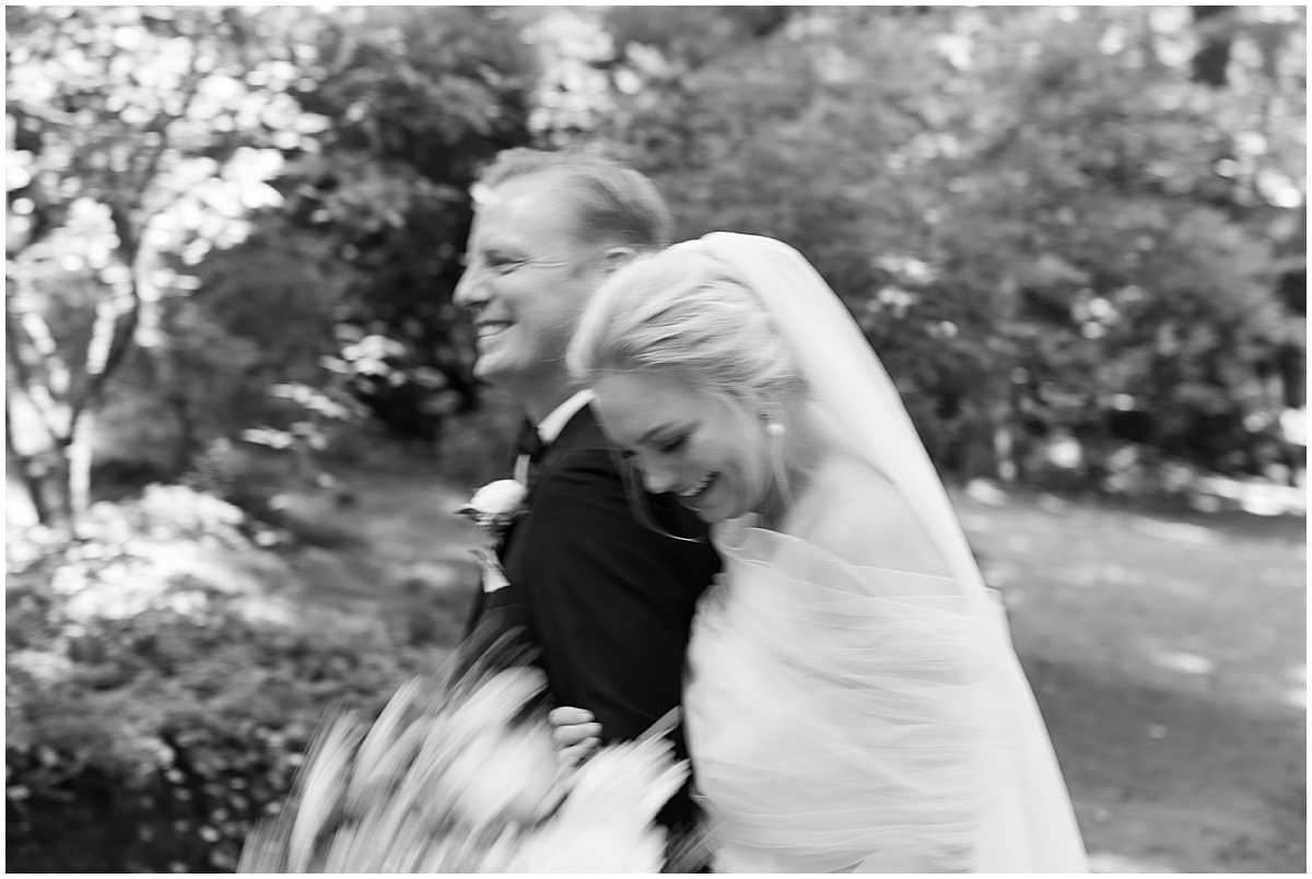 Blurry Black and White of Bride and Groom Laughing Photo