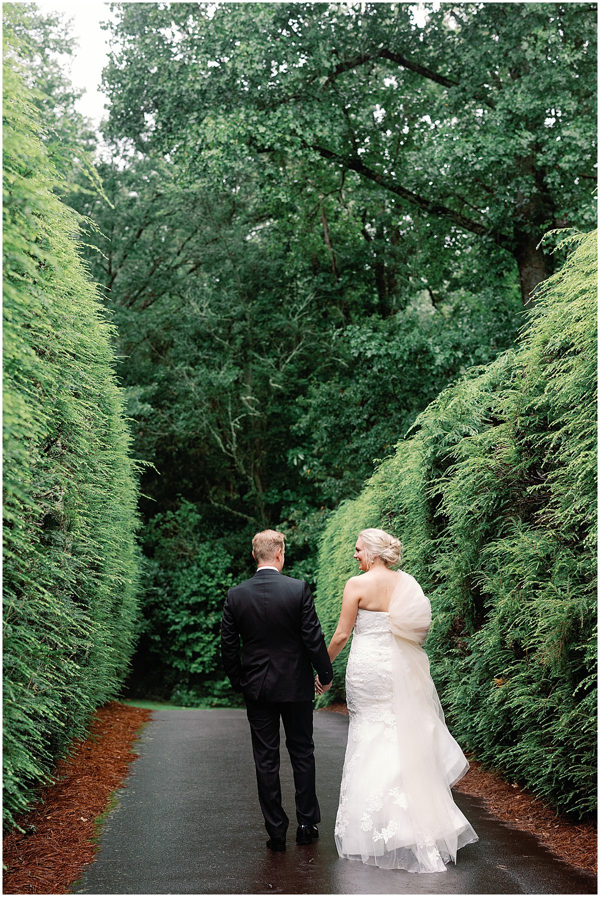 Bride and Groom Holding Hands at Their Wedding in Highlands North Carolina Photo