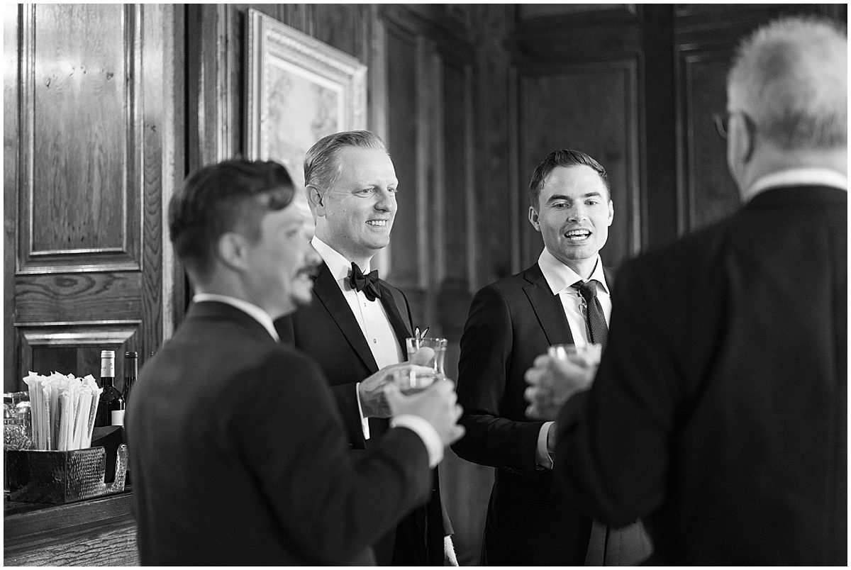 Black and white of Groom toasting with Groomsmen Photo