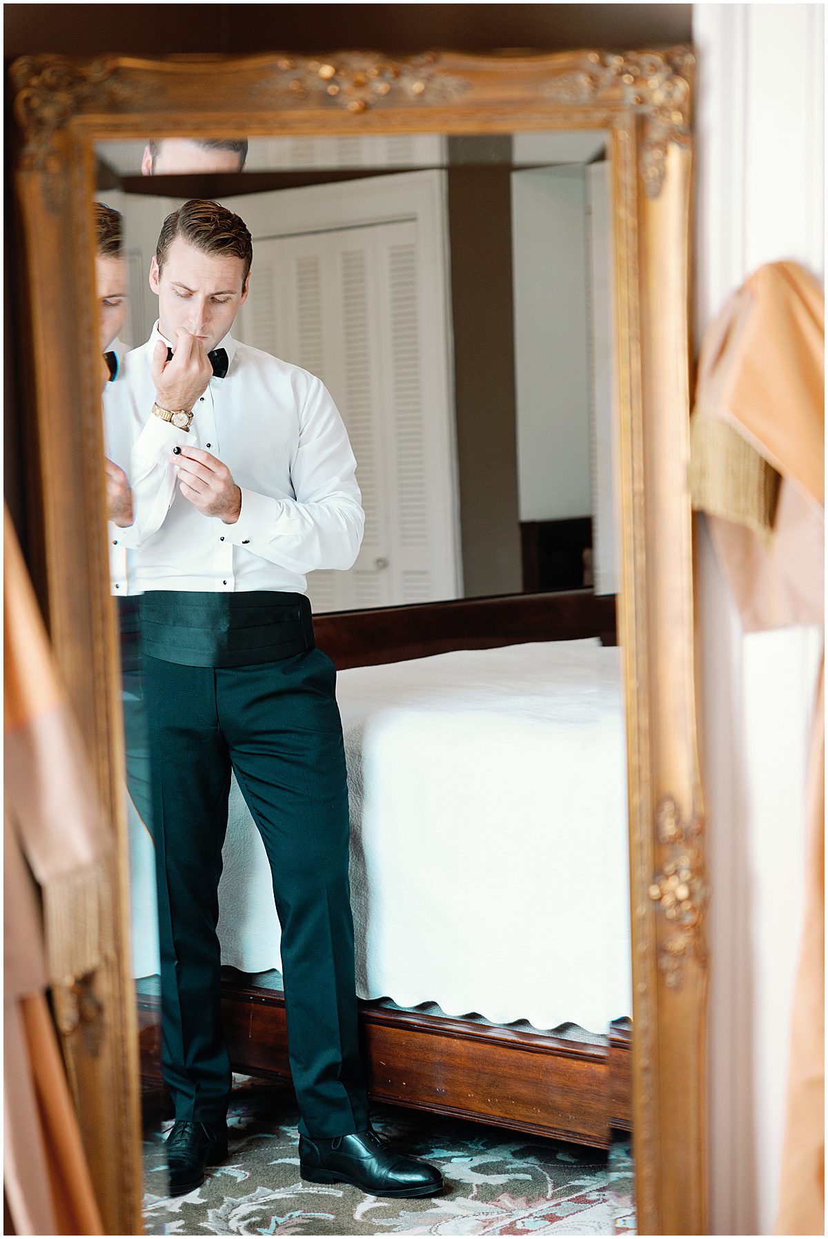 Groom Getting Dressed at The Parsonage In Charleston SC Photo
