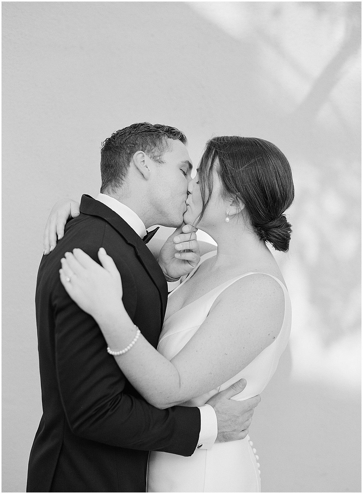 Black and White of Bride and Groom Kissing at Charleston Wedding Photo