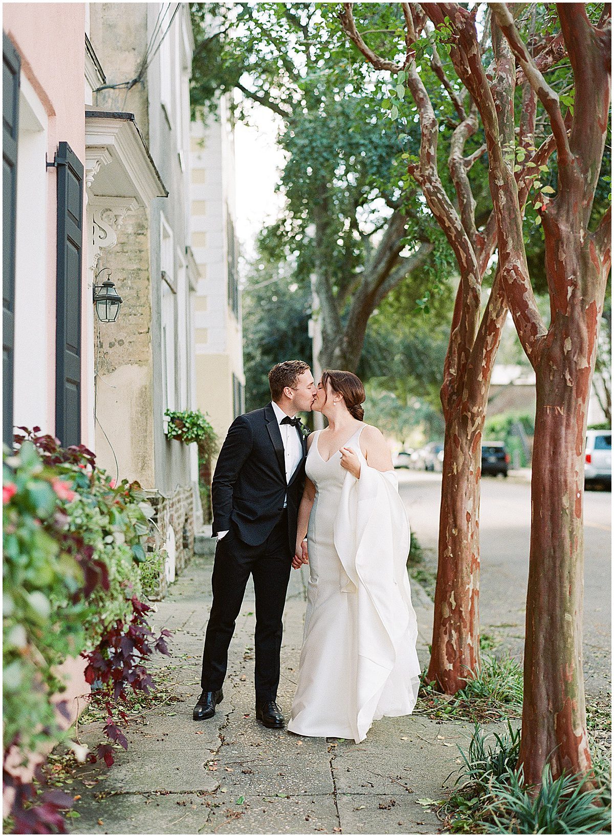 Bride and Groom Kissing on Street of Charleston SC Photo