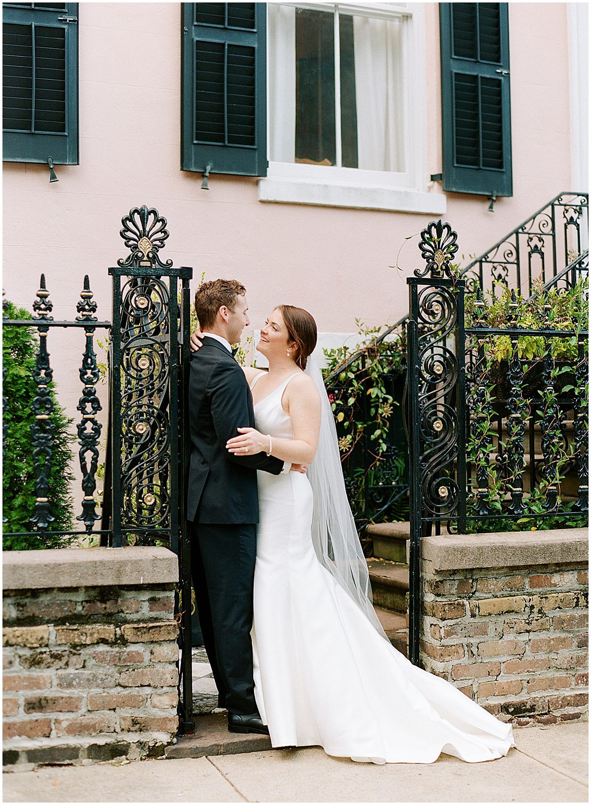 Bride and Groom Hugging In Front of The Parsonage Wedding Venue In Charleston SC Photo