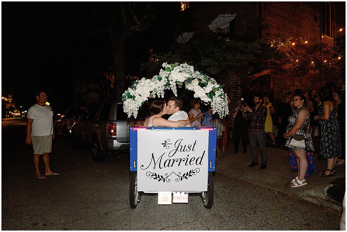 Bride and Groom Kissing in Charleston Pedi Cab Photo