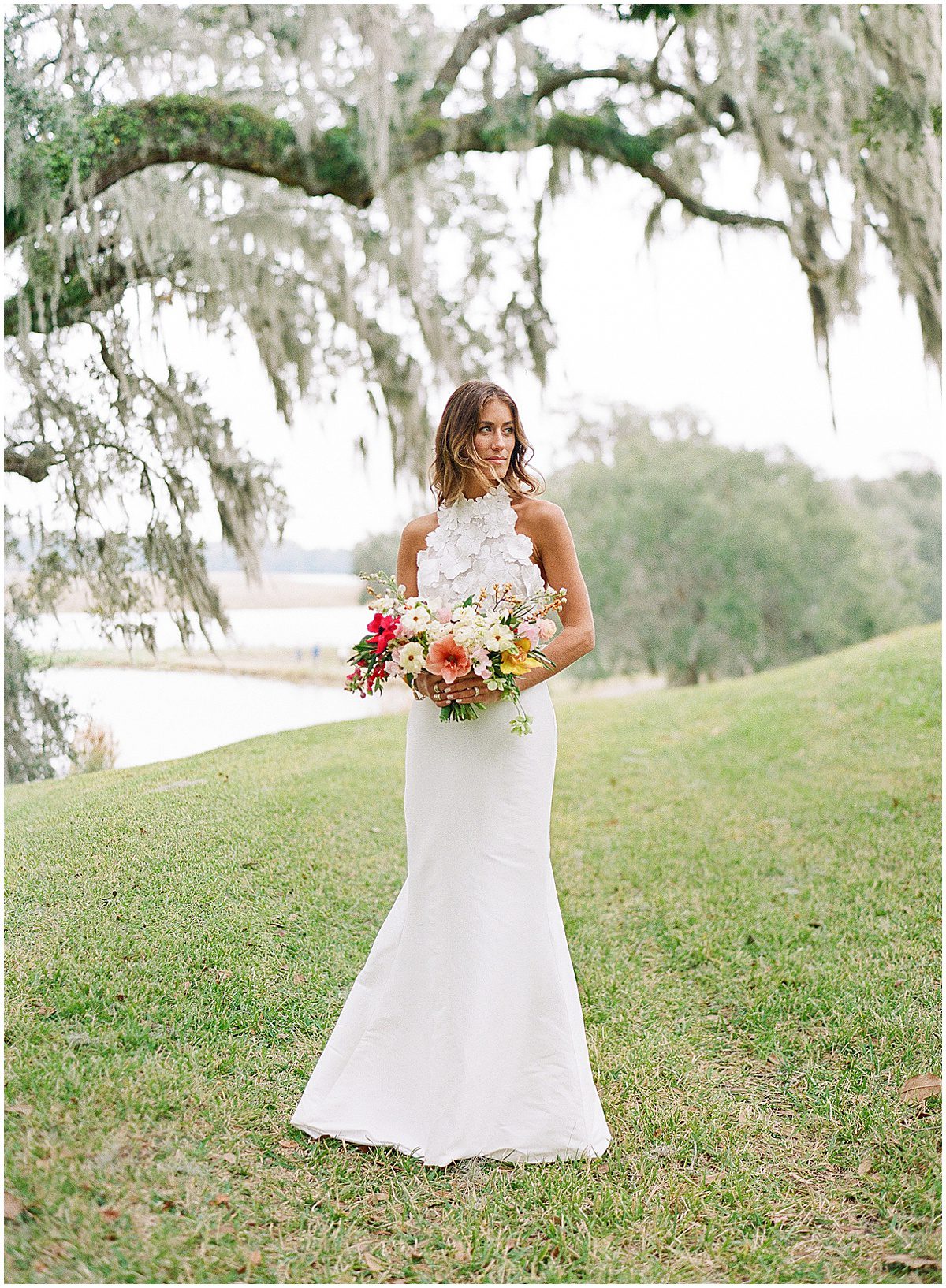Bride Holding Bouquet under Spanish Moss Trees at Middleton Place Photo