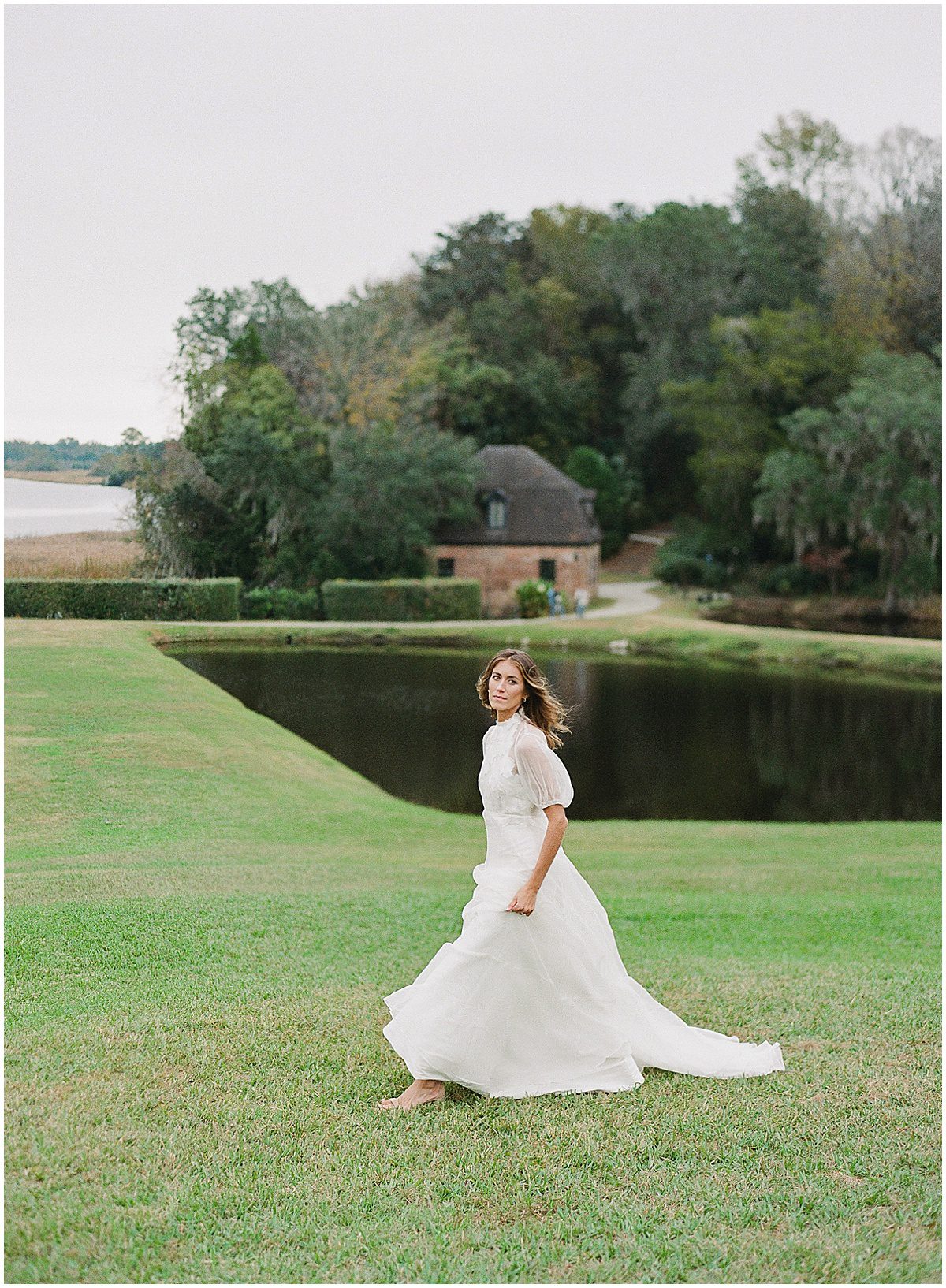 Bride Walking on Lawn at Middleton Place in Charleston South Carolina Photo