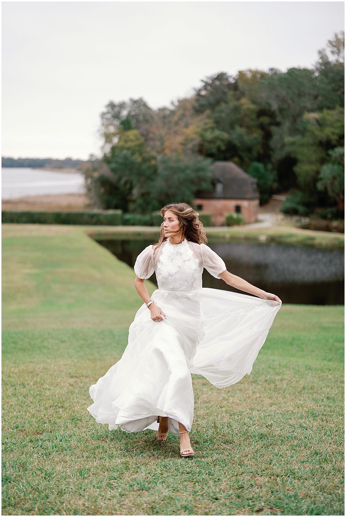 Bride Running Toward Camera at Butterfly Lakes at Middleton Place Photo