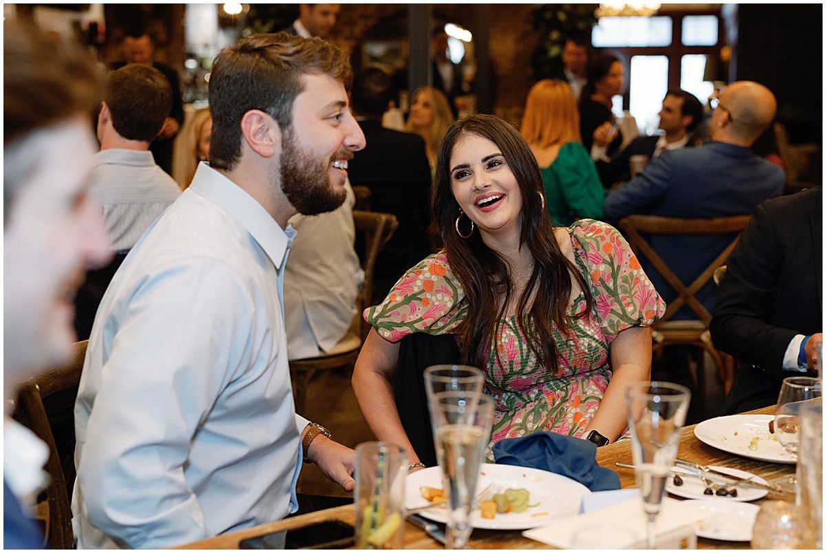 Guests Laughing at Table Photo