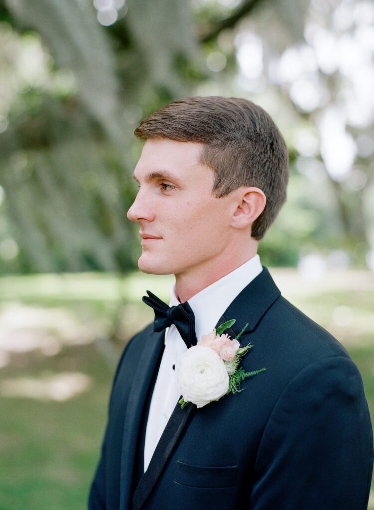 Groom looking off photo