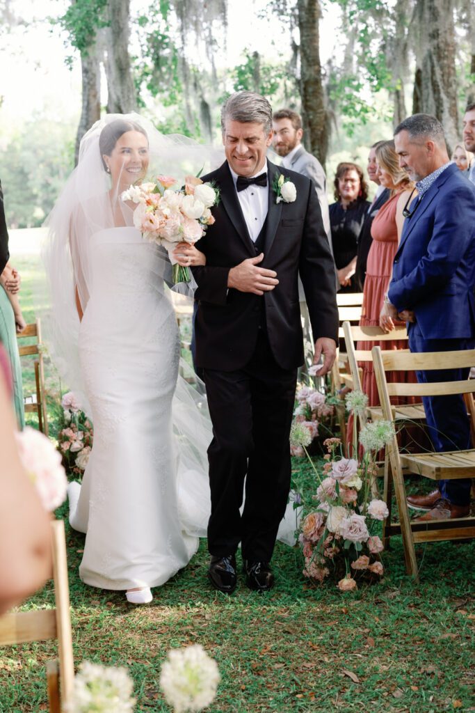 Bride walking down aisle with her dad