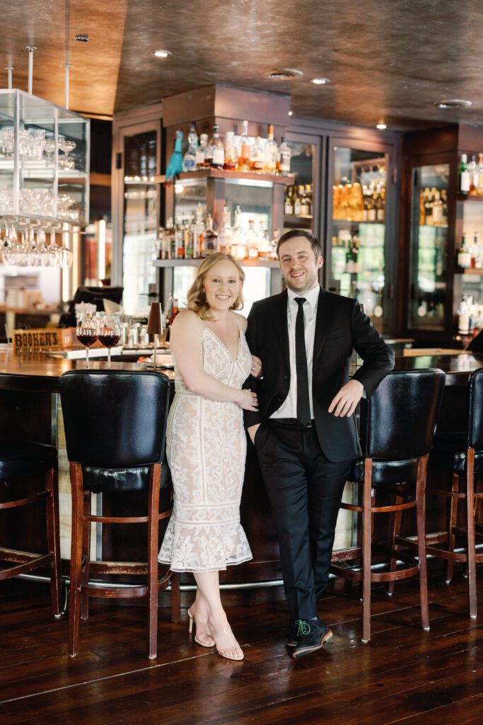 couple leaning on bar