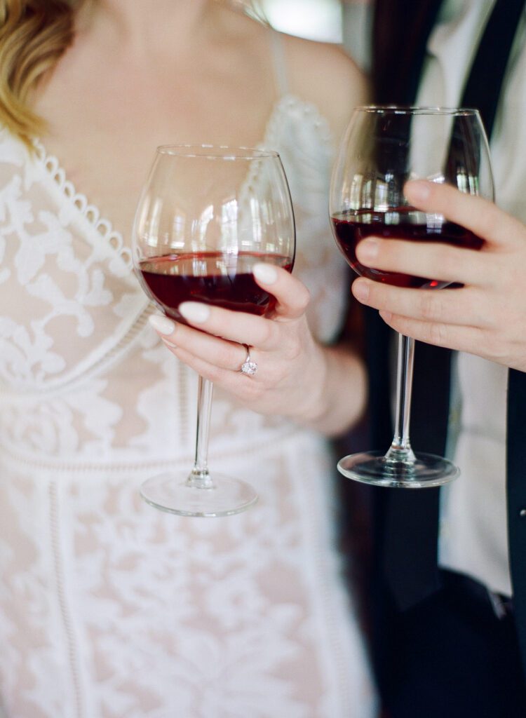 couple holding wine glasses