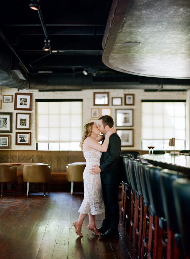 couple kissing at bar in atlanta