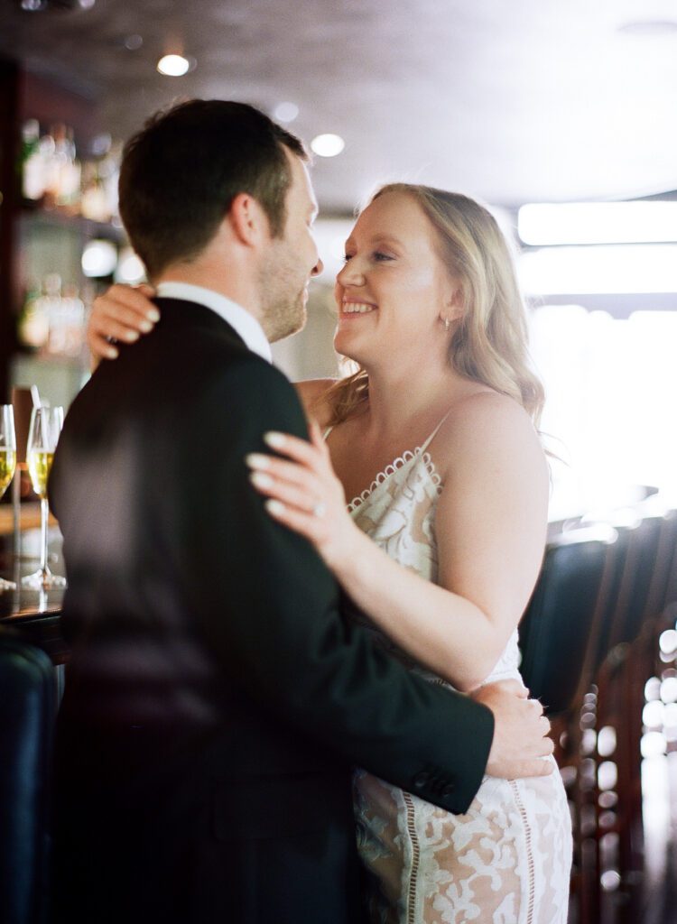 couple smiling hugging