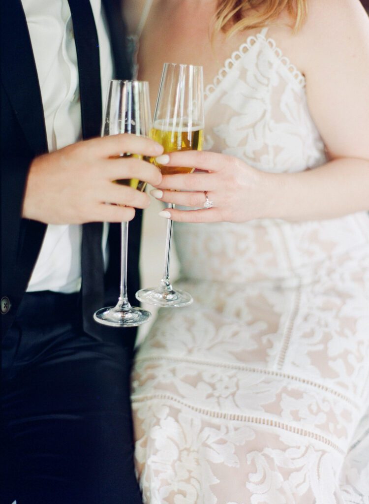 Atlanta Engagement couple holding champagne glasses