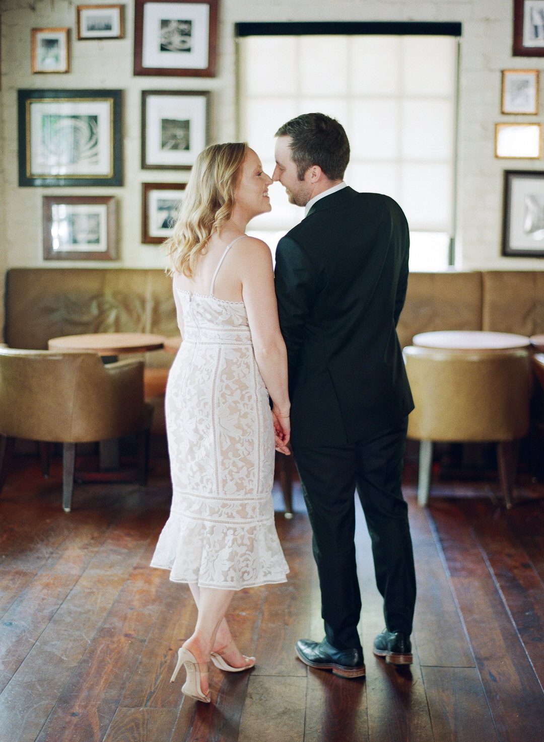 couple in bar nose to nose