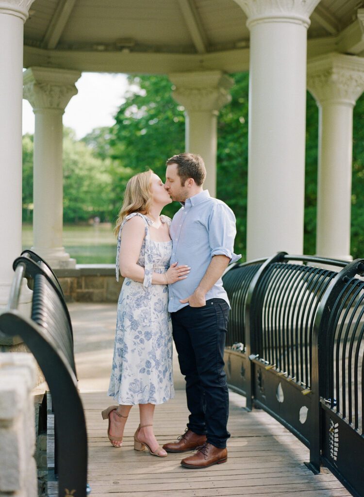 couple kissing at gazebo