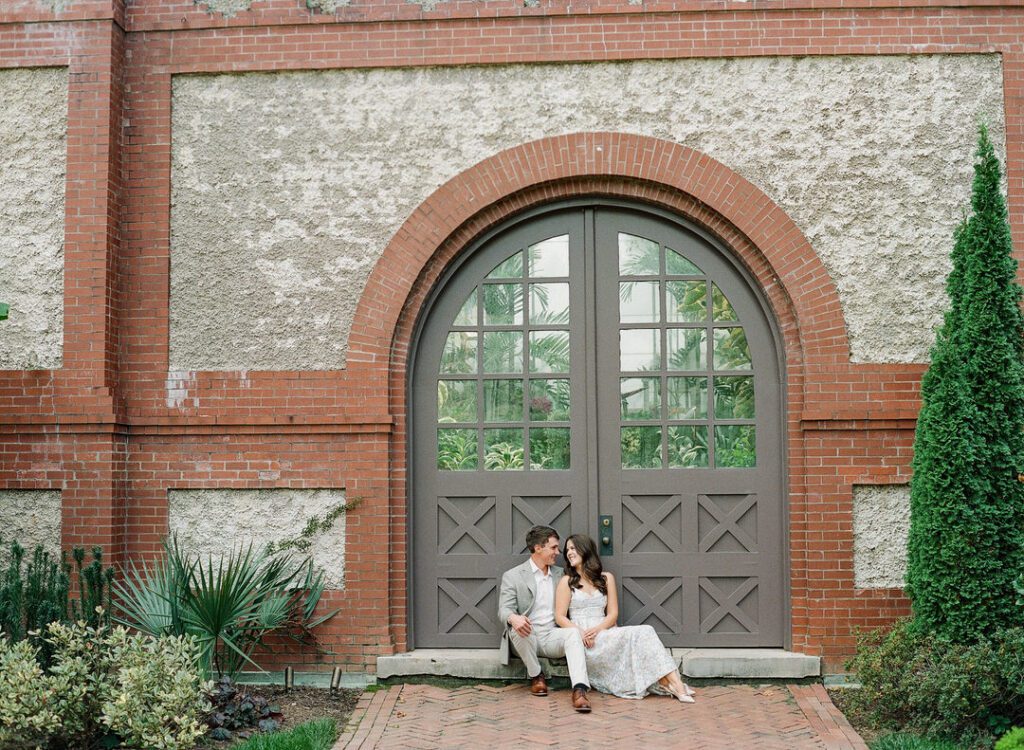 Couple sitting in doorway at the conservatory at The Biltmore Estate